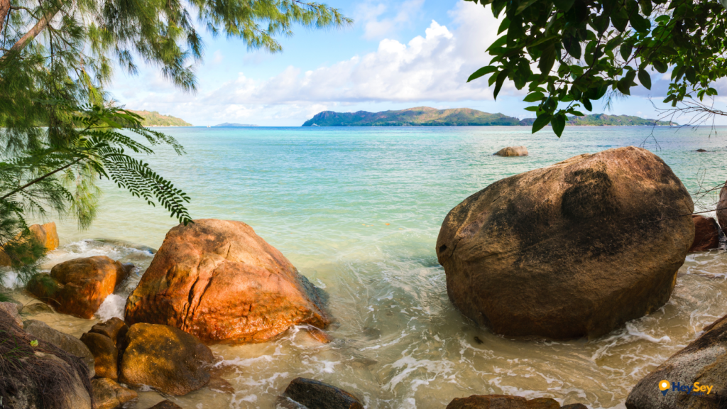 Mahe Seychelles: A Local Guide to Victoria, Morne Seychellois National Park & Hidden Beaches - hidden beach mahe seychelles granite boulders.png Hidden beach on Mahé Island Seychelles with granite boulders turquoise water and quiet tropical scenery